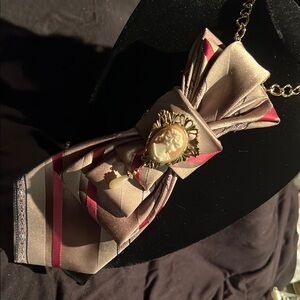 Elegant Brown and Red Scarf with Cameo Detail